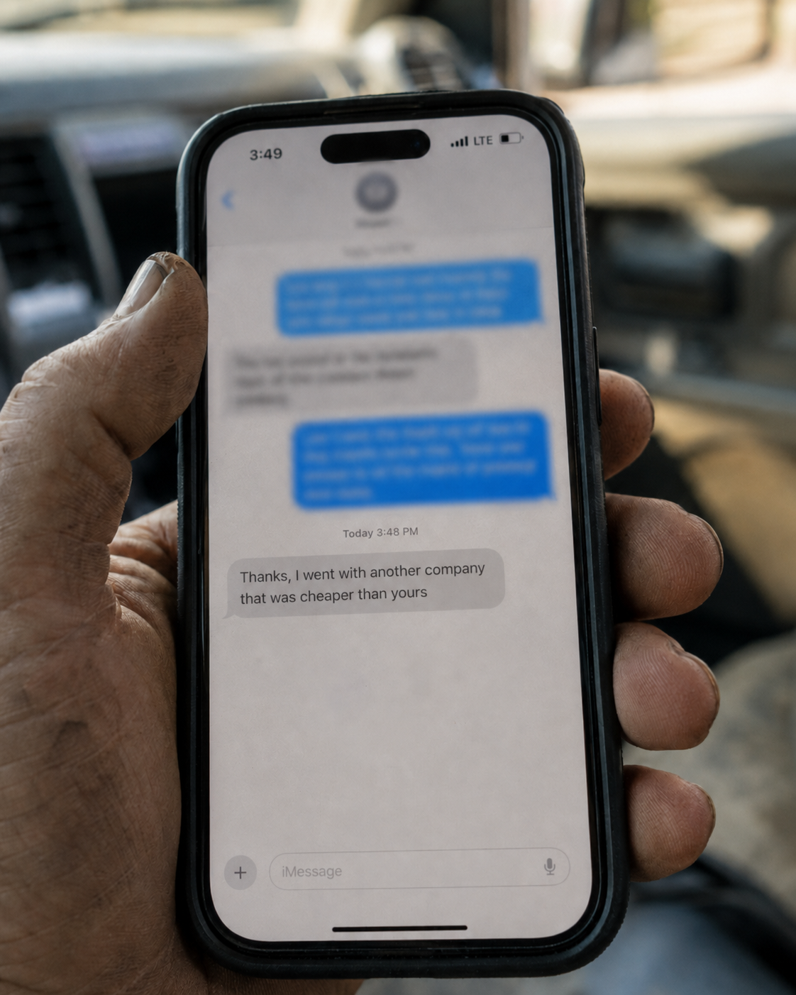 Phone showing a text saying they went with a cheaper company